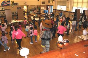 Morse students and staff at a dance party for students who completed their summer reading packs 